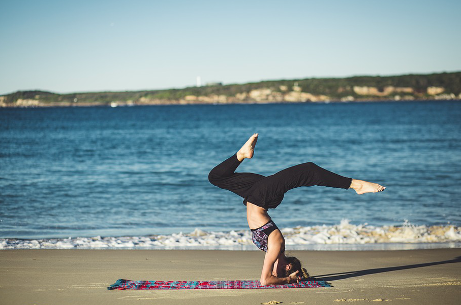 A person standing in front of a beach

Description automatically generated