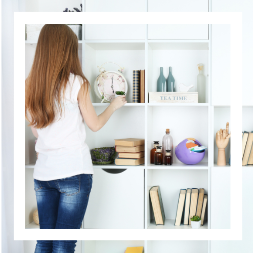 Woman decluttering a shelf