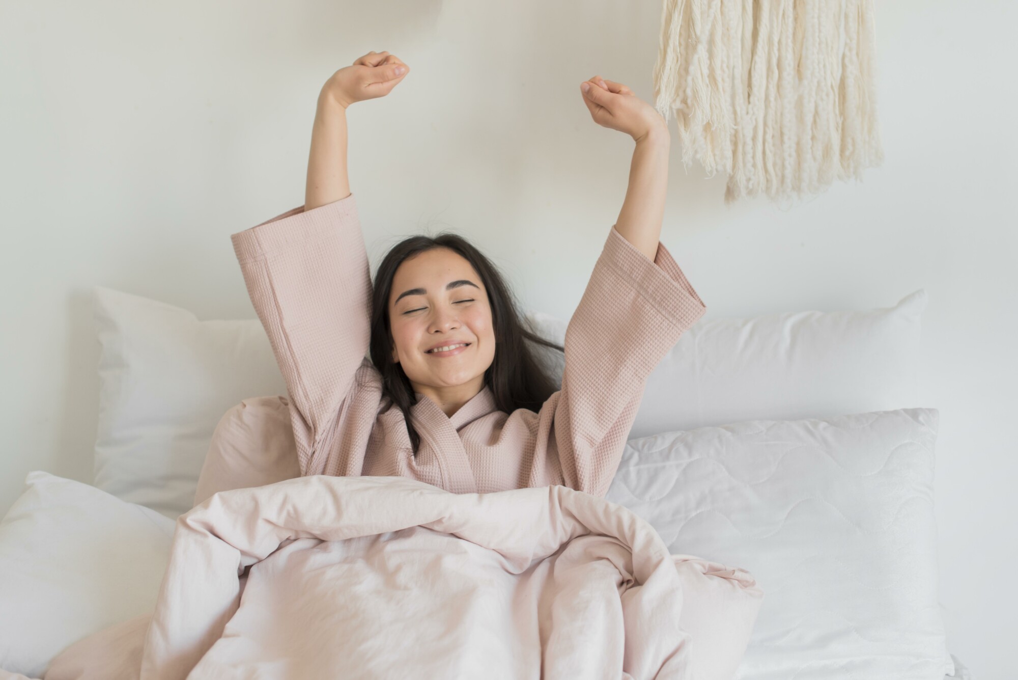 Confident, well-rested mom after learning how to support her child’s sleep with expert coaching