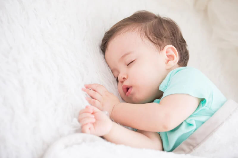  Well-rested baby sleeping independently after learning healthy sleep habits