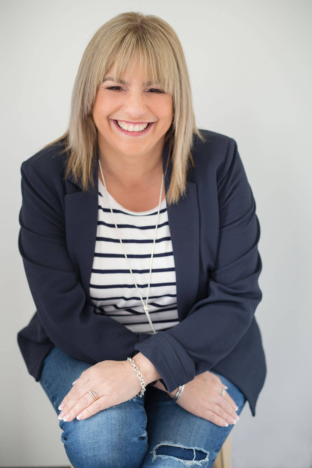  Warm, approachable hypnotherapist creating a safe and welcoming space for women seeking support