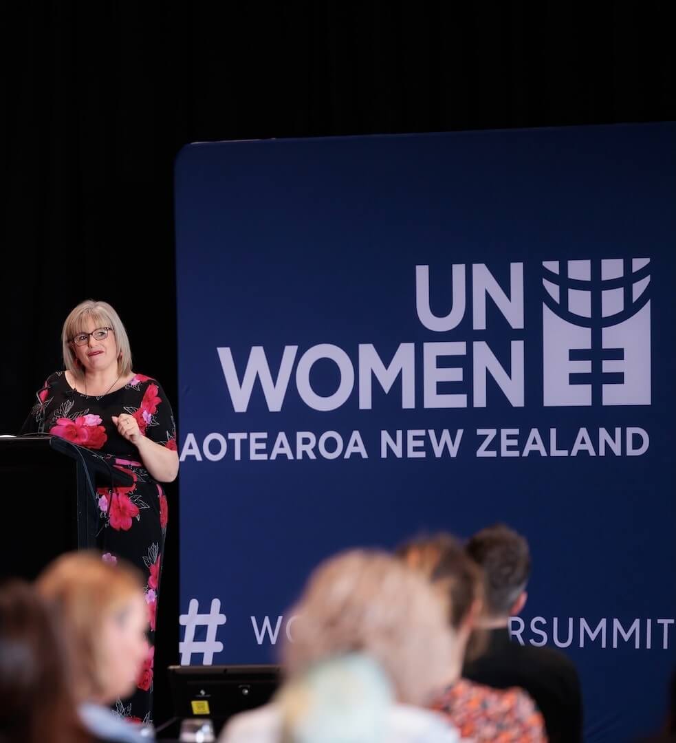  Professional women’s health speaker delivering a keynote on menopause, burnout, stress, and nervous system regulation.