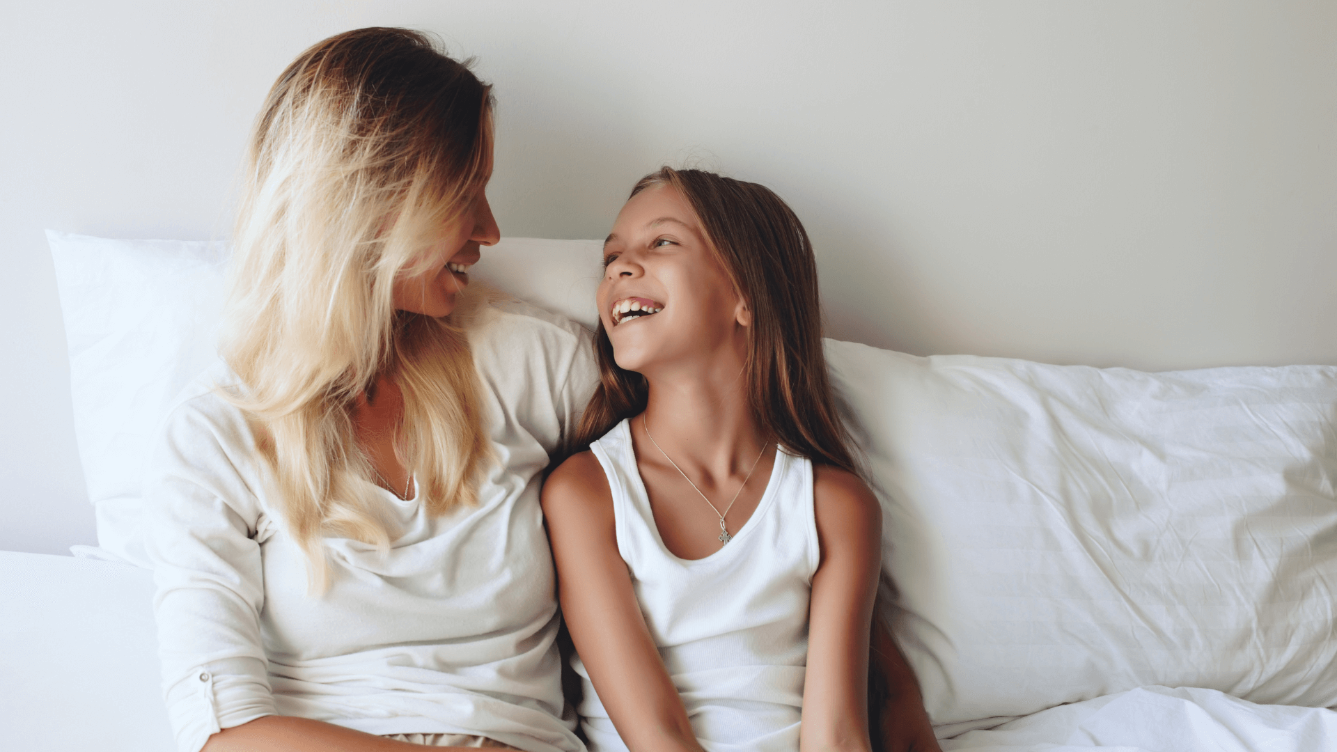  Parent and child sharing a relaxed, joyful moment, representing restored connection and emotional safety.