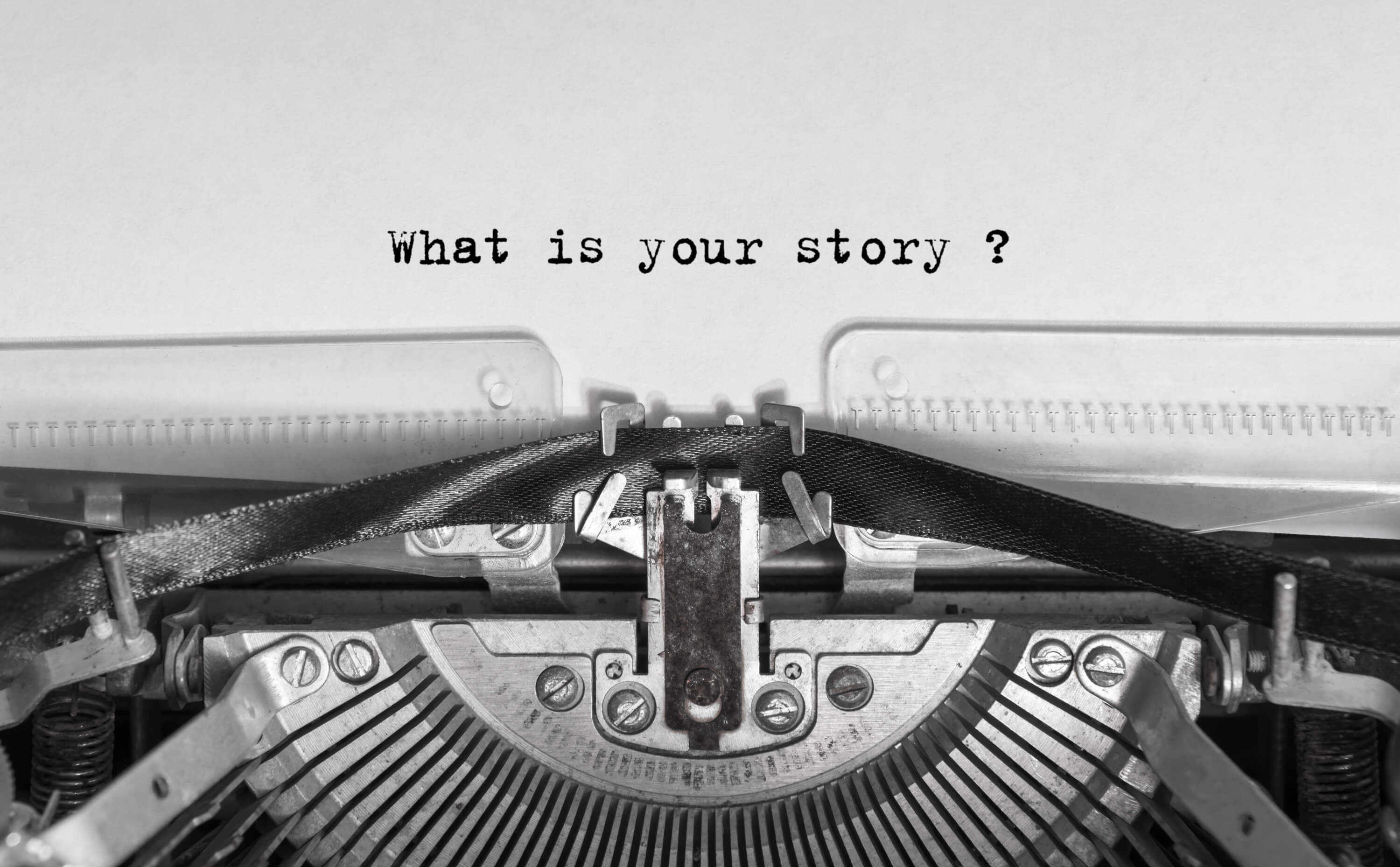  Typewriter with the words "What is your story?" on the page