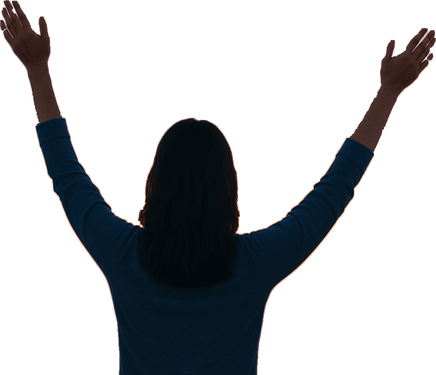 Silhouette raising hands at sunrise