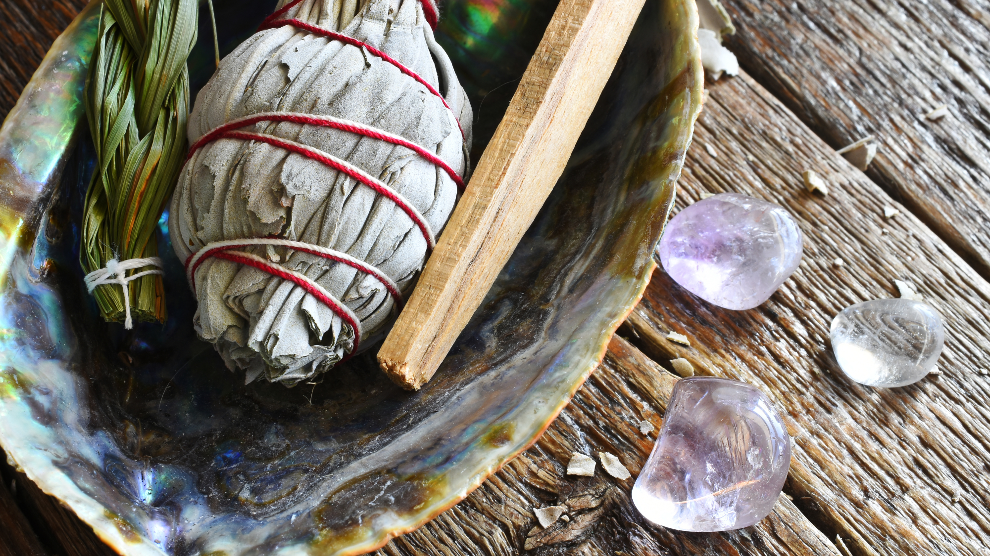 Smudging shell with herbs and crystals